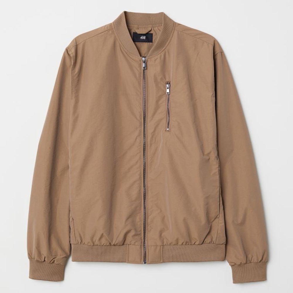 Bomber jacket with a ribbed stand-up collar and zip down the front.